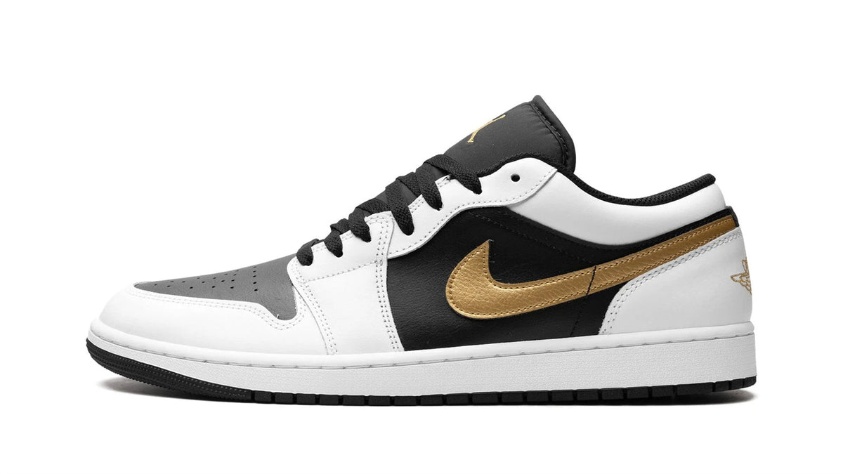 Air Jordan 1 Low "Gold Swoosh" sneaker product image 1 | Foot Spikes